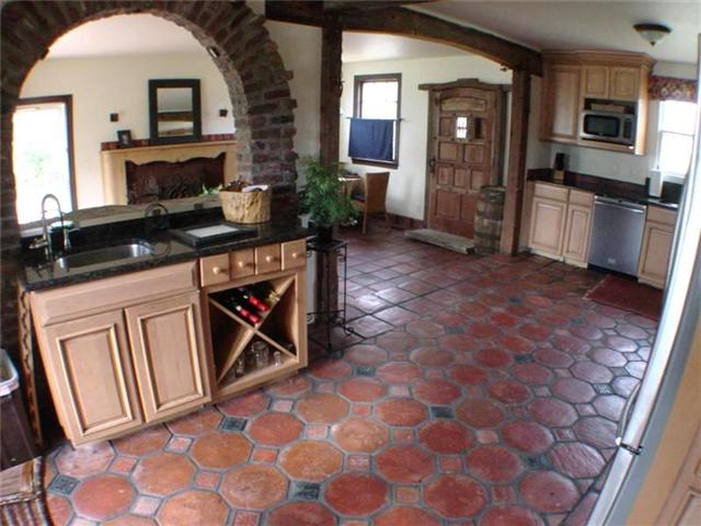 2351 Neelys Bend Road Madison, TN 37115 - Photo 7 of 14 Kitchen area with brick arch looking into den.