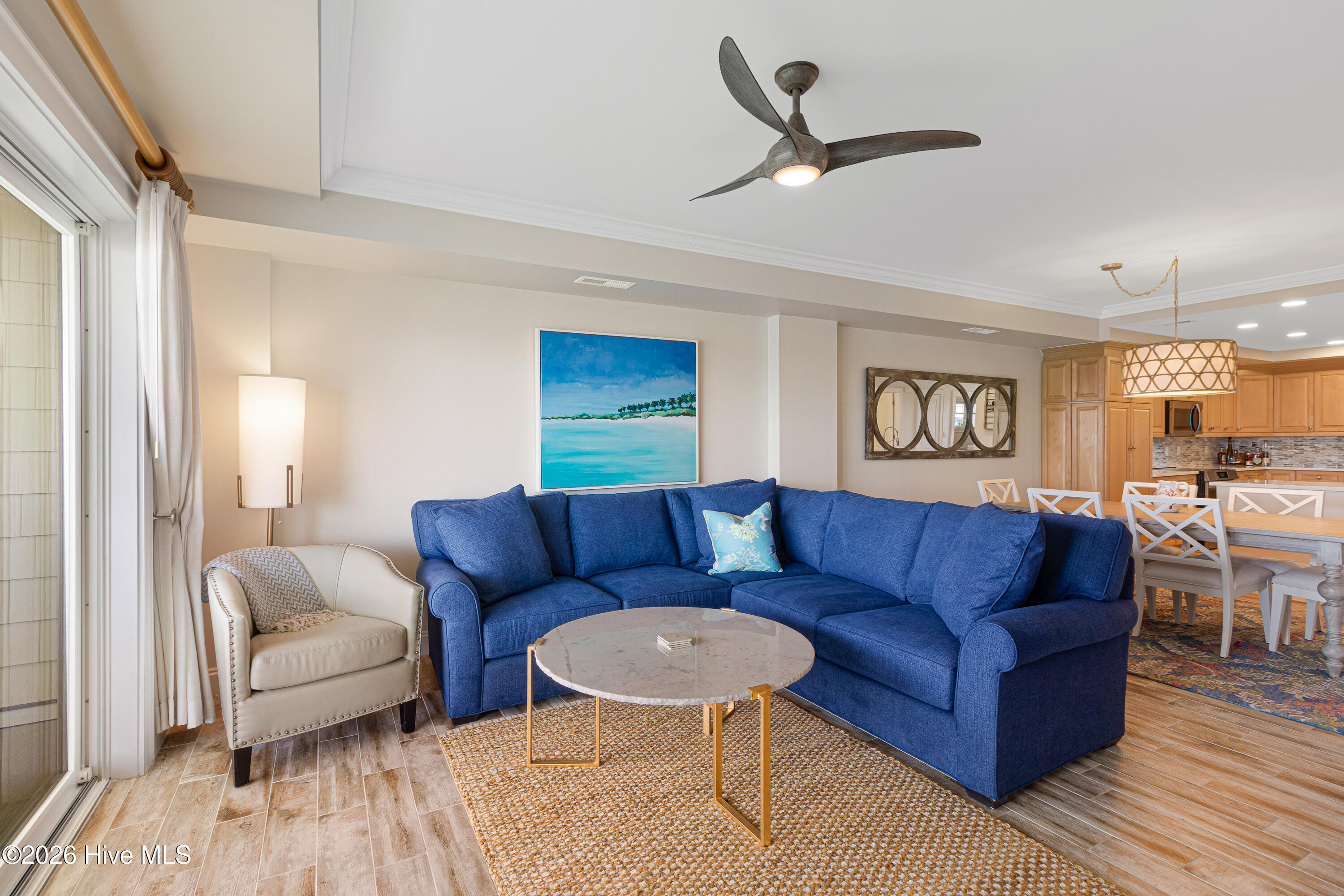 212 Old Causeway Road, Unit 107 & B13 SLIP Beaufort, NC 28516 - Photo 5 of 49 Living room with covered balcony access