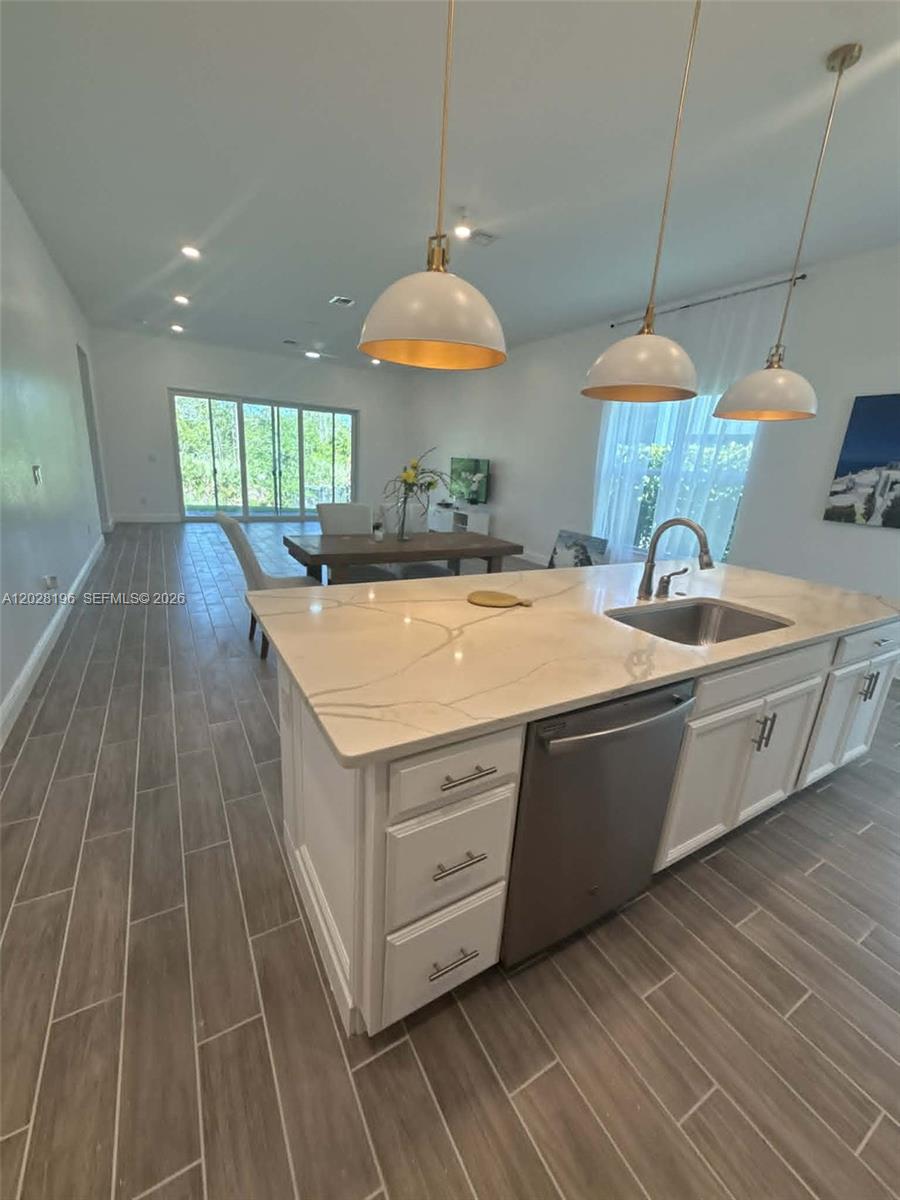 a kitchen with a sink and a stove