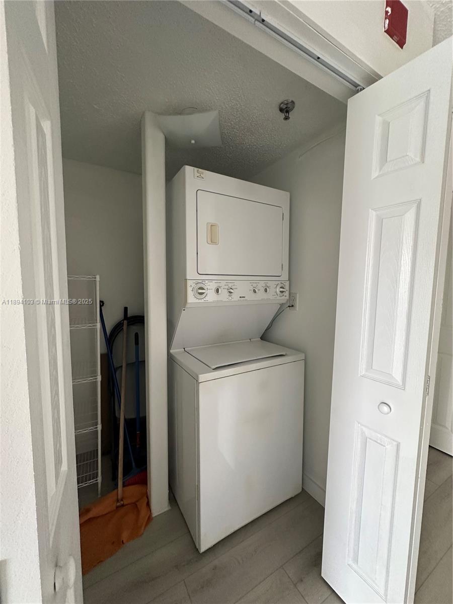 1852 Southwest 7th Street, Unit 109 Miami, FL 33135 - Photo 4 of 21 a utility room with dryer and washer