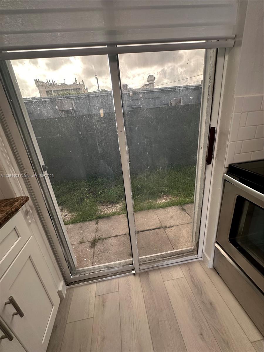 1852 Southwest 7th Street, Unit 109 Miami, FL 33135 - Photo 5 of 21 a bathroom with a glass shower door