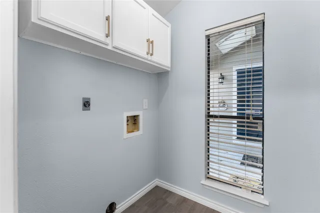 a view of a kitchen cabinets and a window