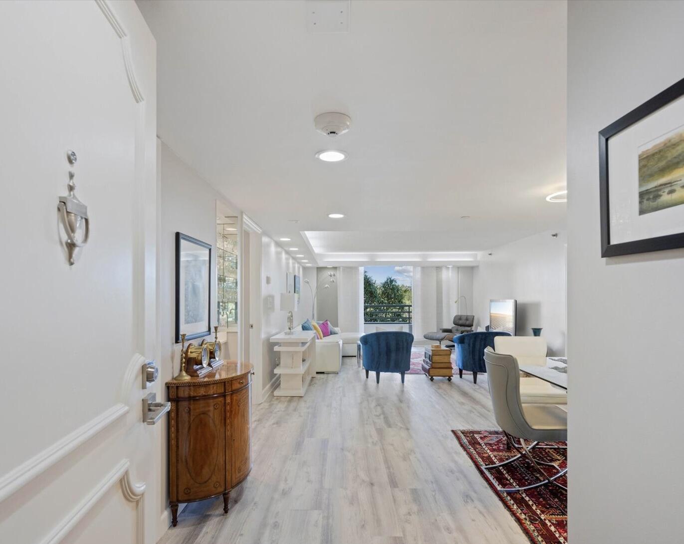 4101 North Ocean Boulevard, Unit 308 Boca Raton, FL 33431 - Photo 8 of 23 a living room with furniture appliances and wooden floor