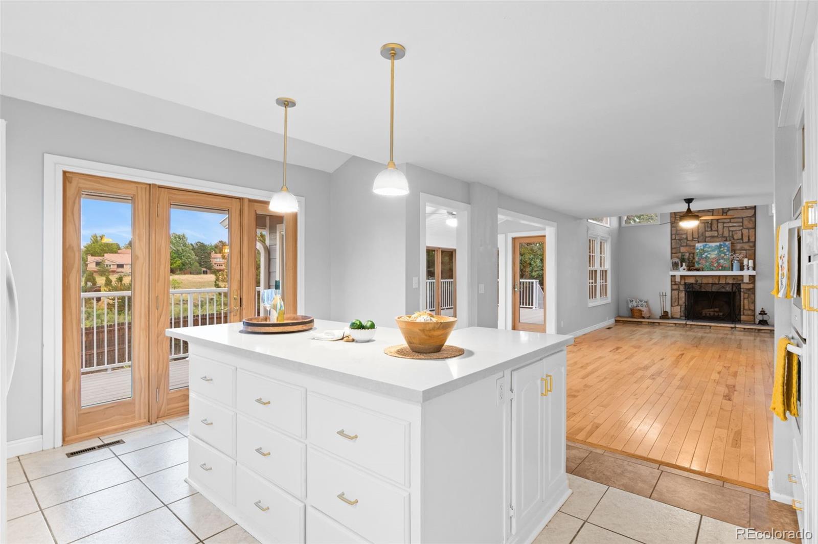 8385 Sweet Water Road Lone Tree, CO 80124 - Photo 12 of 50 a kitchen that has a sink and a wooden floor