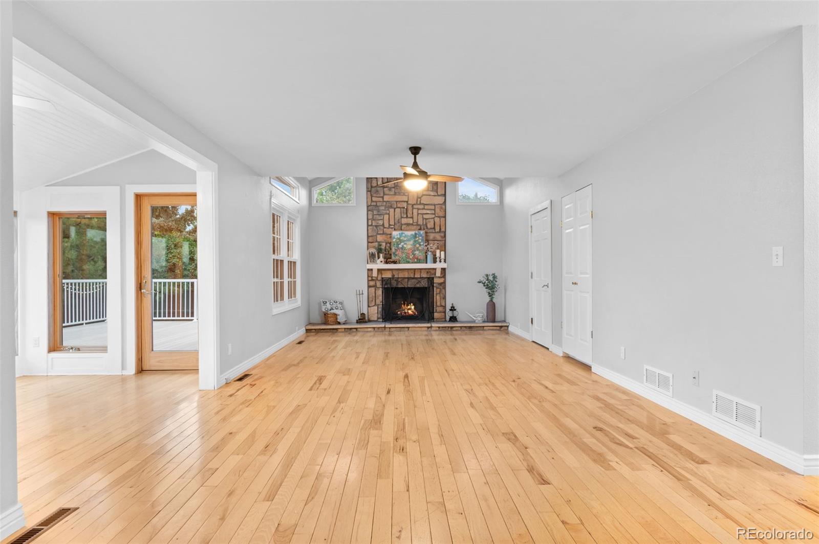 8385 Sweet Water Road Lone Tree, CO 80124 - Photo 17 of 50 wooden floor in an empty room with a window