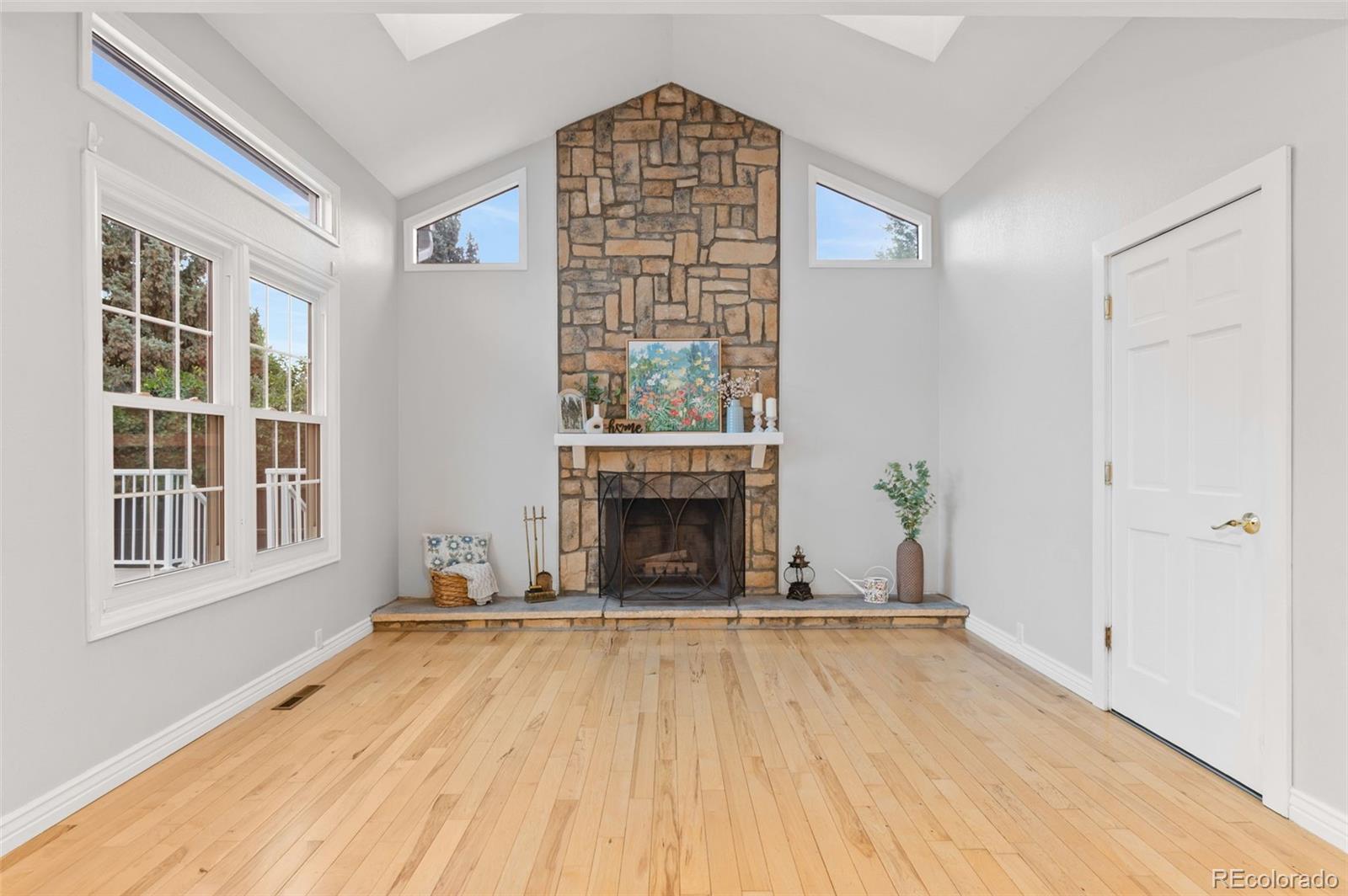 8385 Sweet Water Road Lone Tree, CO 80124 - Photo 18 of 50 a view of an empty room with a window and fireplace