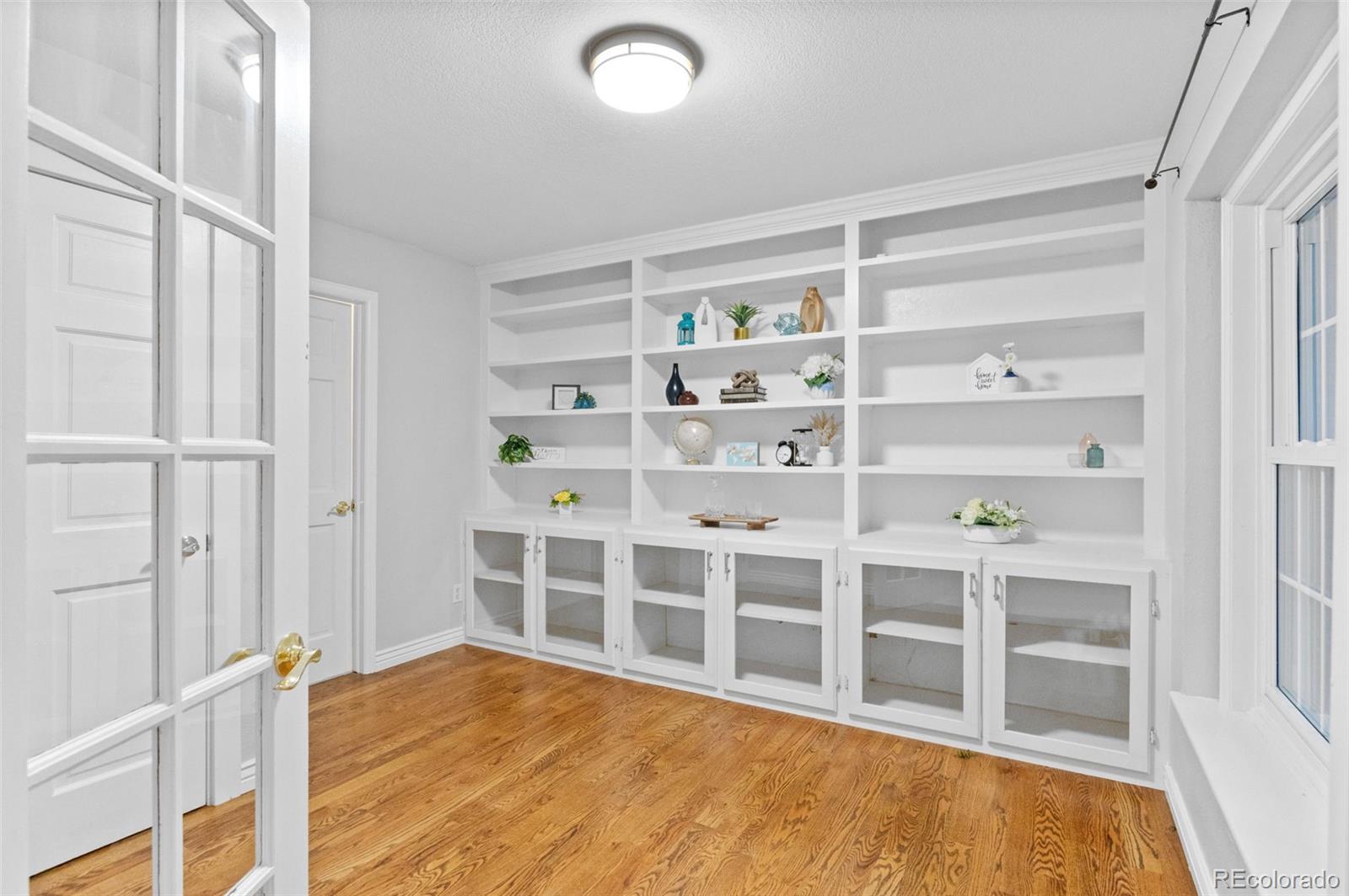 8385 Sweet Water Road Lone Tree, CO 80124 - Photo 21 of 50 a view of an empty room with wooden floor and closet