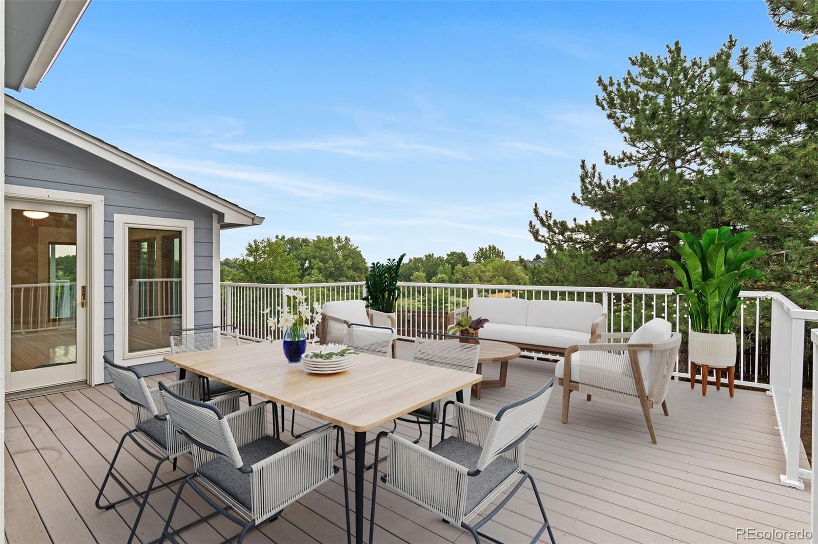 8385 Sweet Water Road Lone Tree, CO 80124 - Photo 33 of 50 a view of a patio with a table and chairs