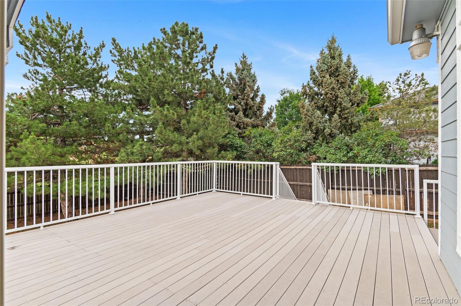8385 Sweet Water Road Lone Tree, CO 80124 - Photo 35 of 50 a view of a wooden deck