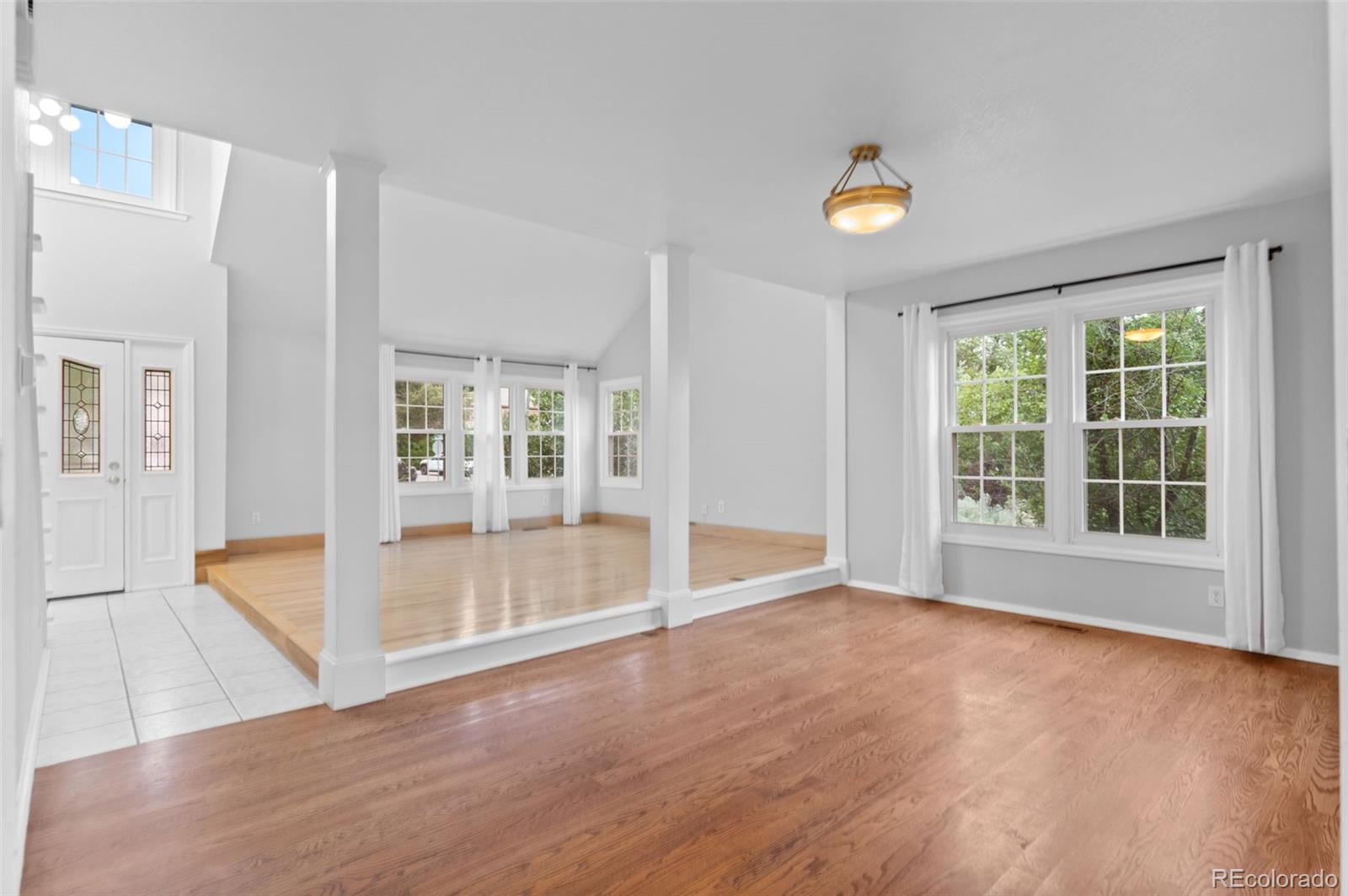8385 Sweet Water Road Lone Tree, CO 80124 - Photo 8 of 50 a view of an empty room with glass door and windows