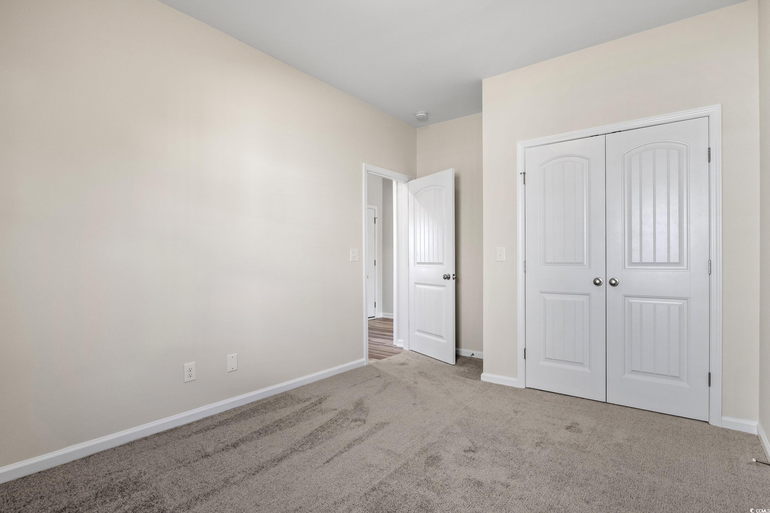 316 Lakota Loop Longs, SC 29568 - Photo 11 of 17 Unfurnished bedroom featuring light carpet and a c