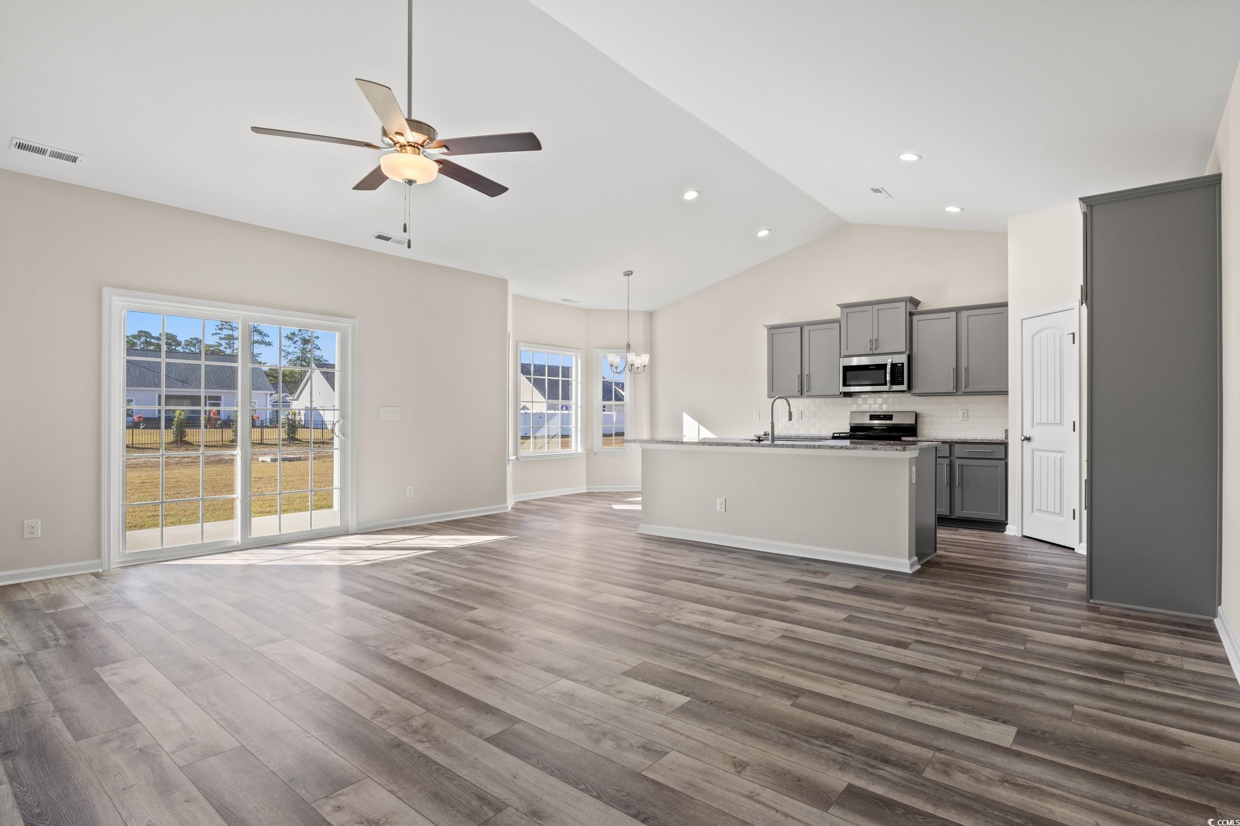 316 Lakota Loop Longs, SC 29568 - Photo 3 of 17 Unfurnished living room with dark hardwood / wood-