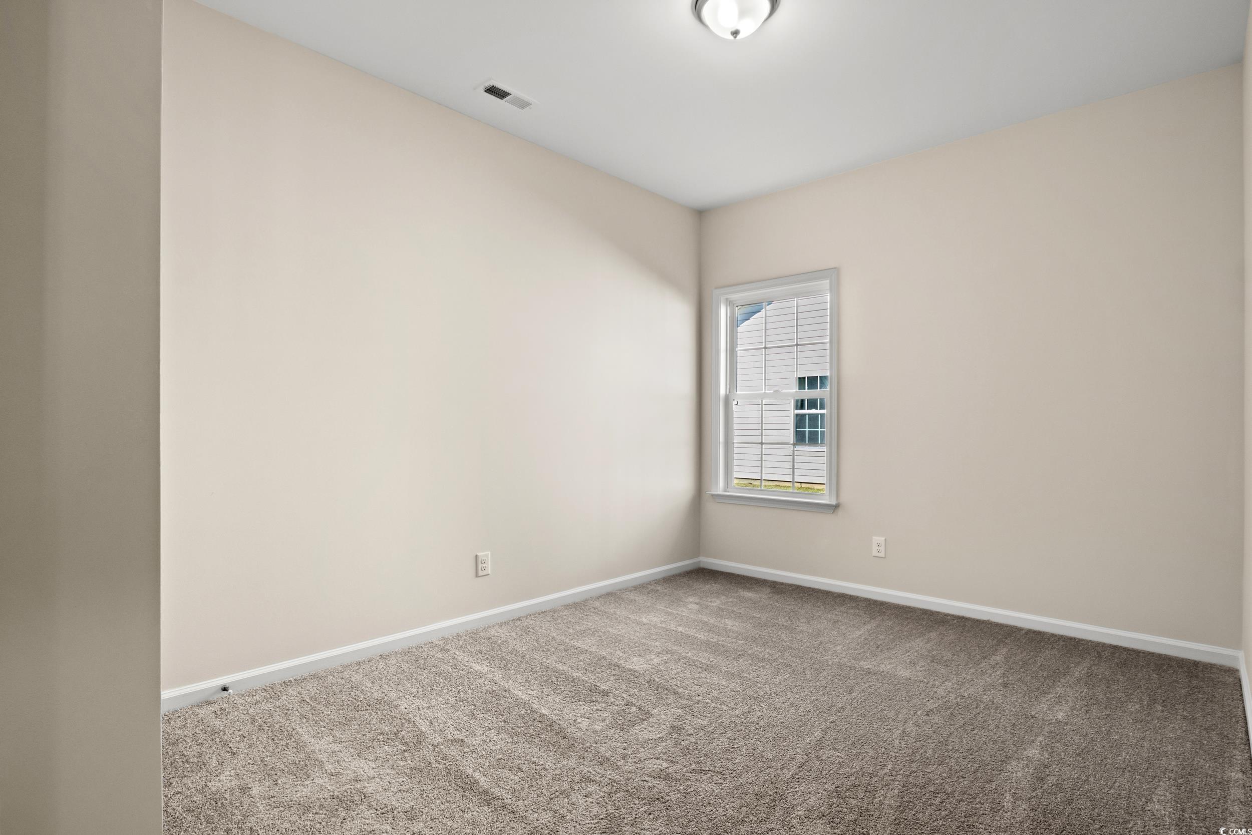 316 Lakota Loop Longs, SC 29568 - Photo 10 of 17 Unfurnished room featuring carpet flooring