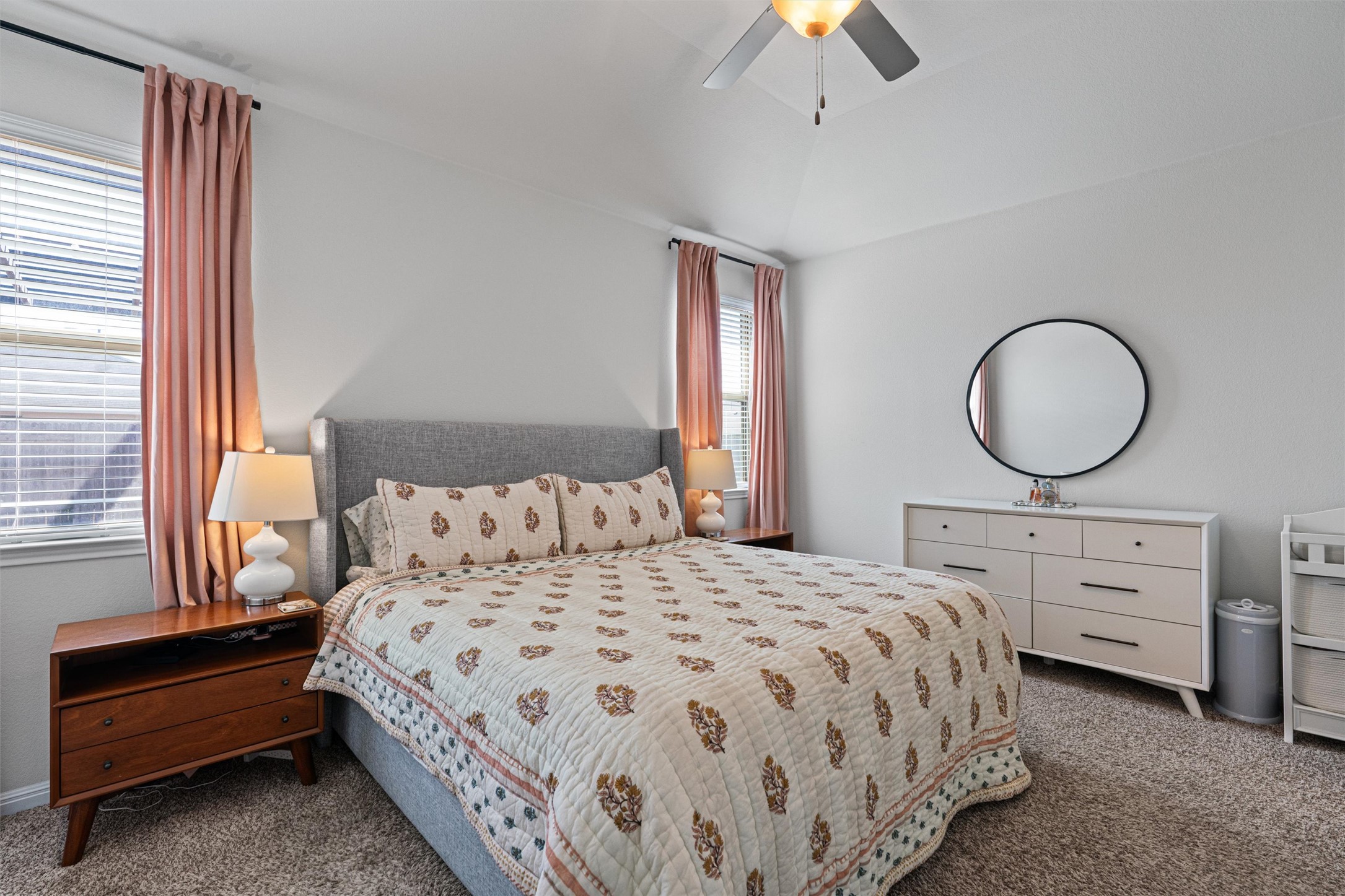 137 Red Sun Drive Kyle, TX 78640 - Photo 12 of 38 a bedroom with a bed and a dresser