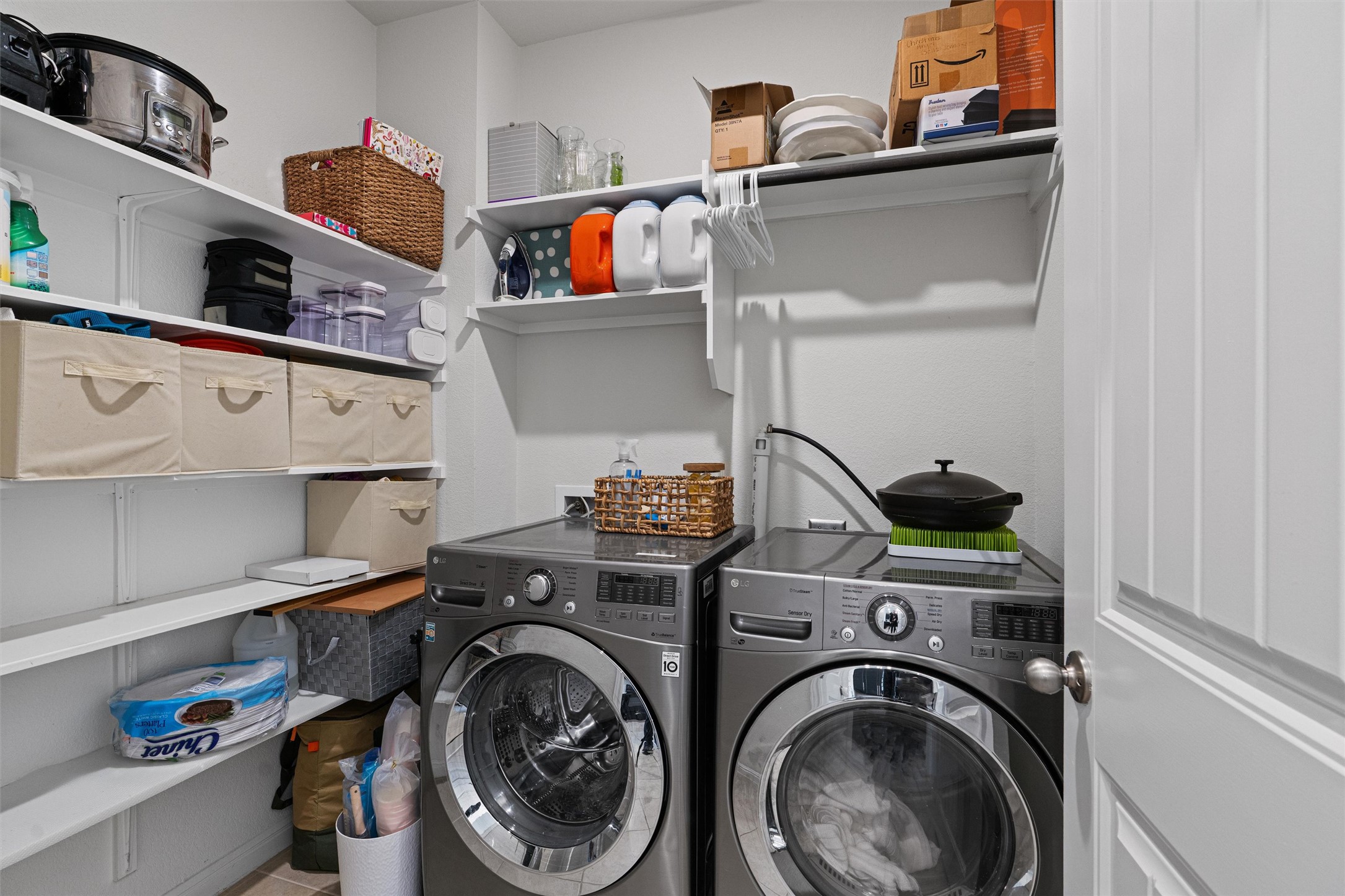 137 Red Sun Drive Kyle, TX 78640 - Photo 17 of 38 a utility room with dryer and washer