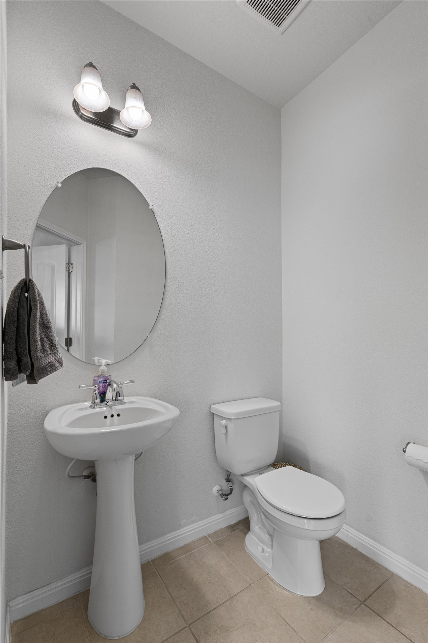 137 Red Sun Drive Kyle, TX 78640 - Photo 19 of 38 a bathroom with a toilet sink and mirror