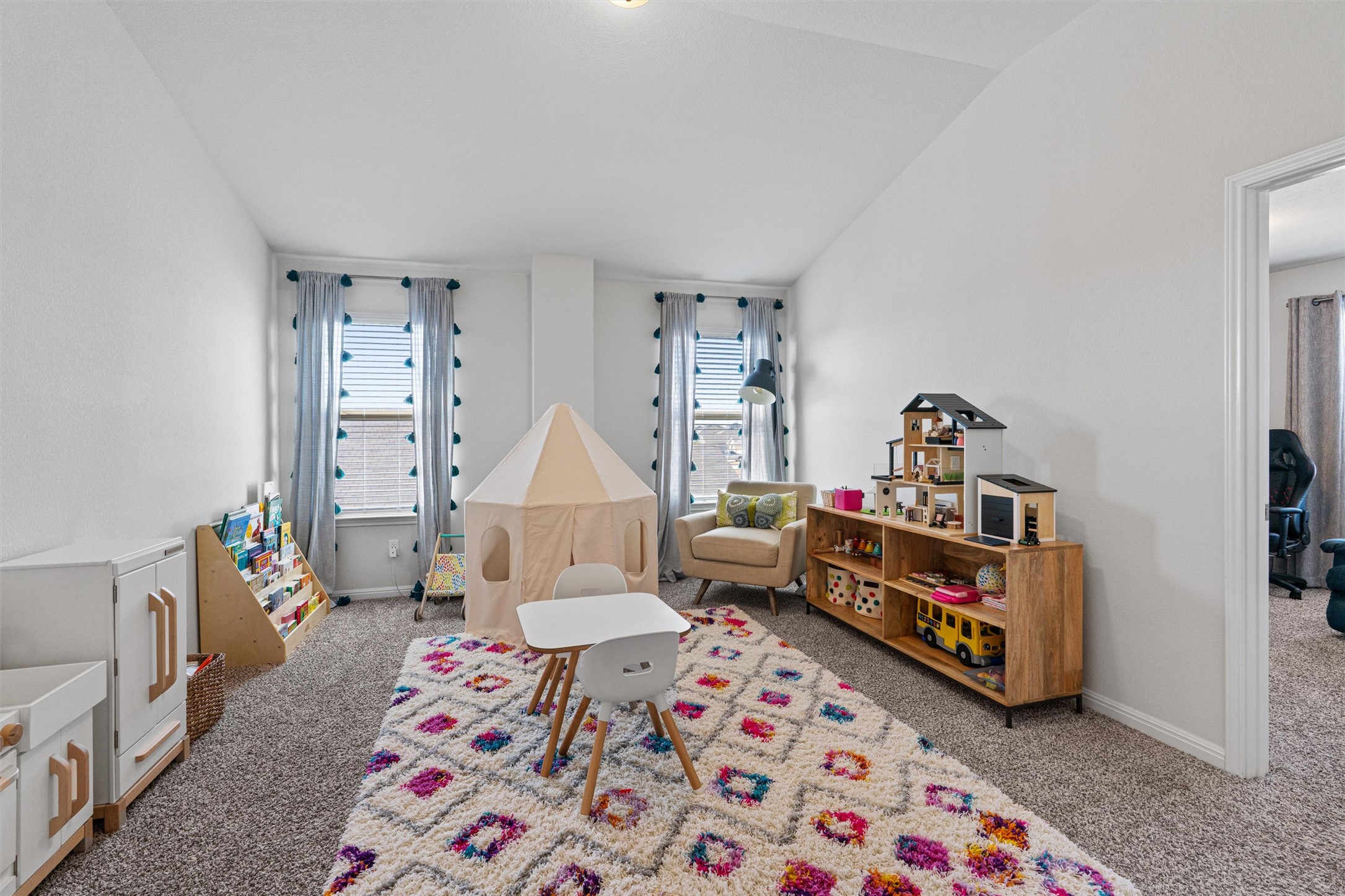 137 Red Sun Drive Kyle, TX 78640 - Photo 20 of 38 a room with furniture a rug and a baby crib