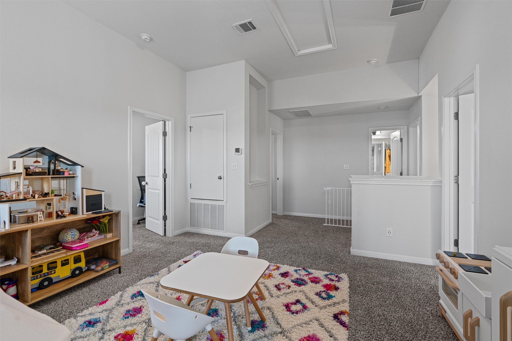 137 Red Sun Drive Kyle, TX 78640 - Photo 21 of 38 a bedroom with furniture and a book shelf