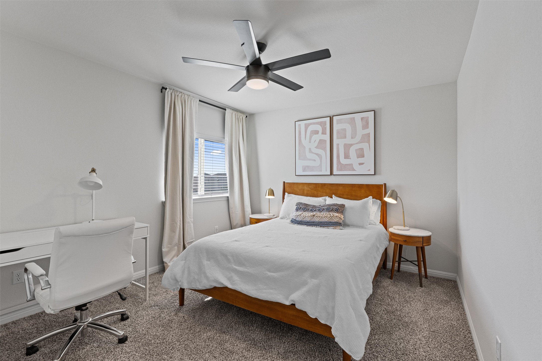 137 Red Sun Drive Kyle, TX 78640 - Photo 22 of 38 a bedroom with a bed and a table in it