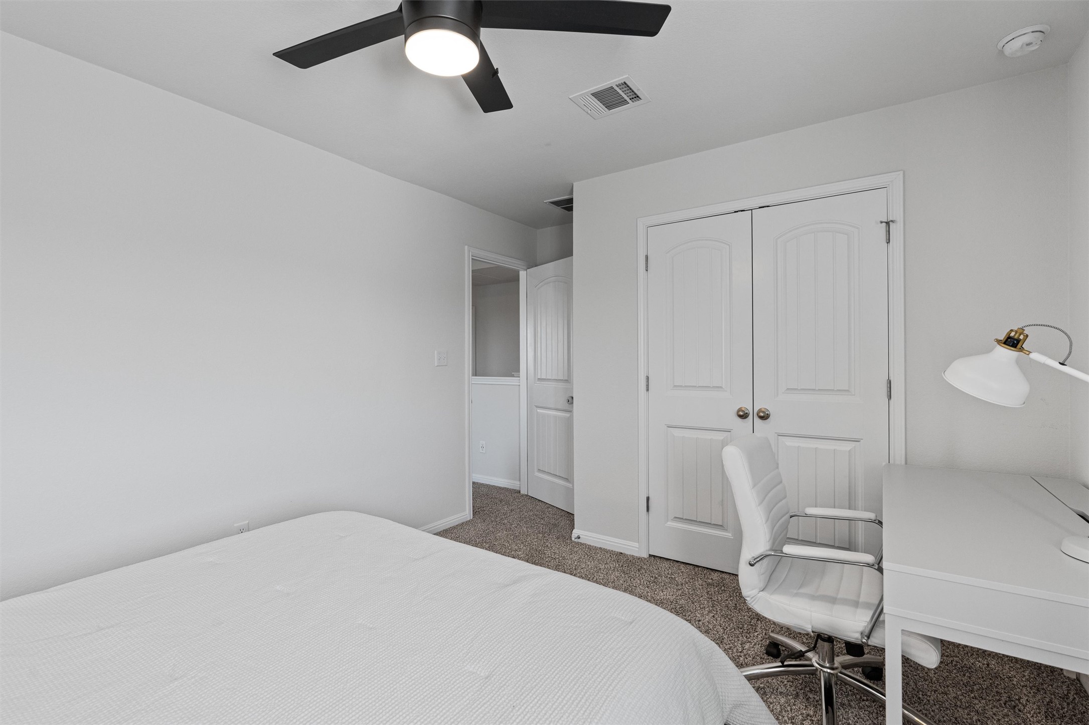 137 Red Sun Drive Kyle, TX 78640 - Photo 23 of 38 a bedroom with a bed and a chair