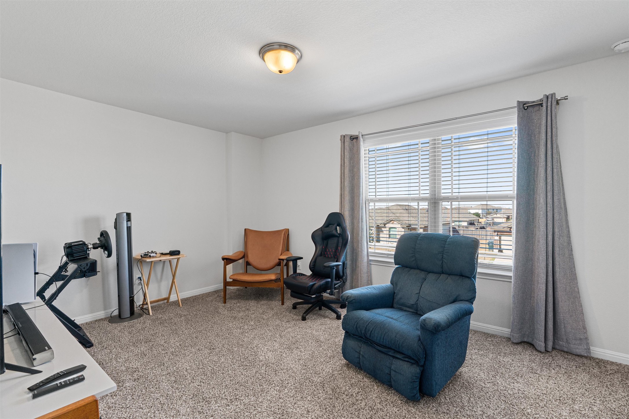137 Red Sun Drive Kyle, TX 78640 - Photo 24 of 38 a living room with furniture a air conditioner vent and a window