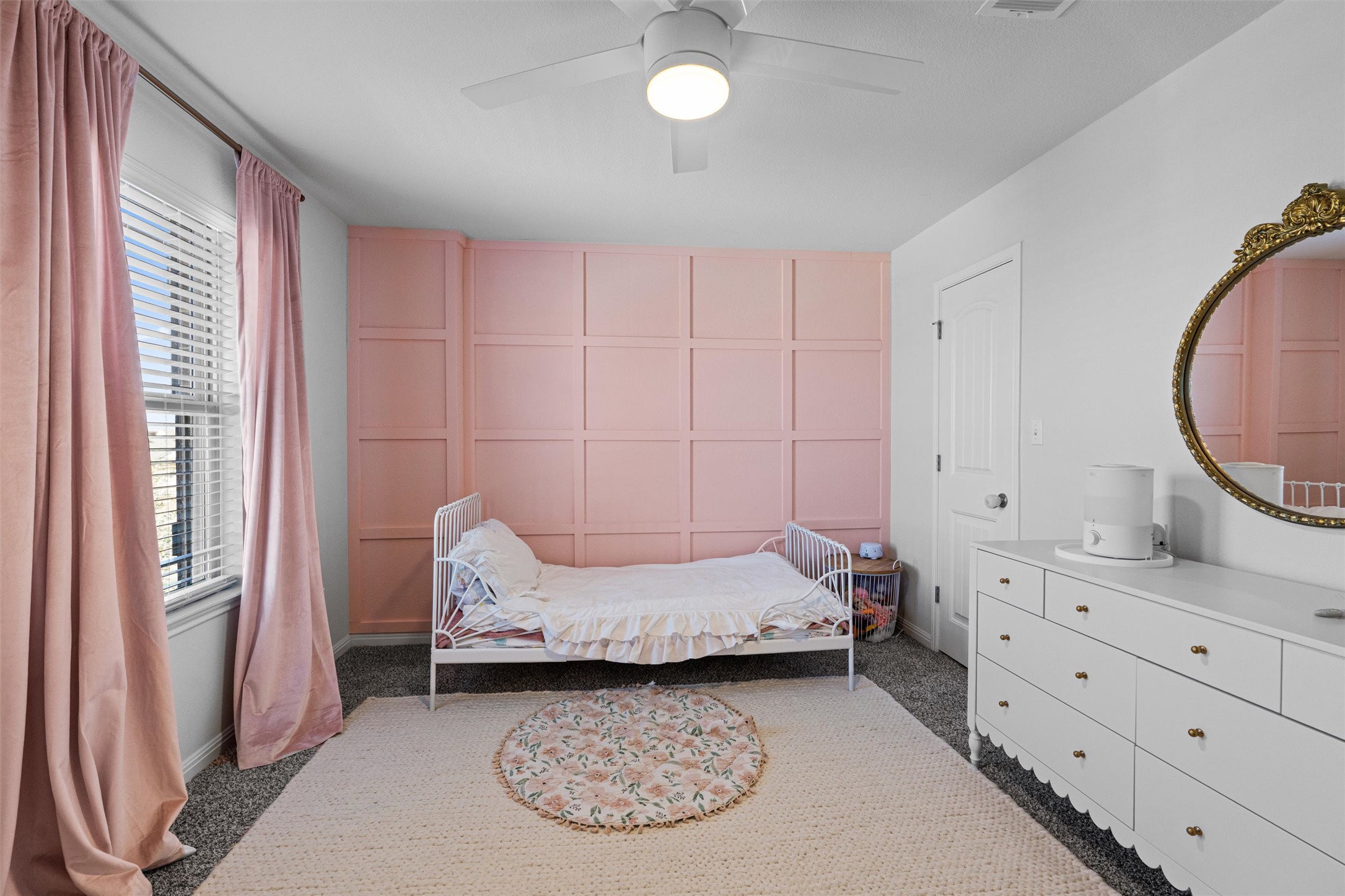 137 Red Sun Drive Kyle, TX 78640 - Photo 28 of 38 a bedroom with a bed and a mirror