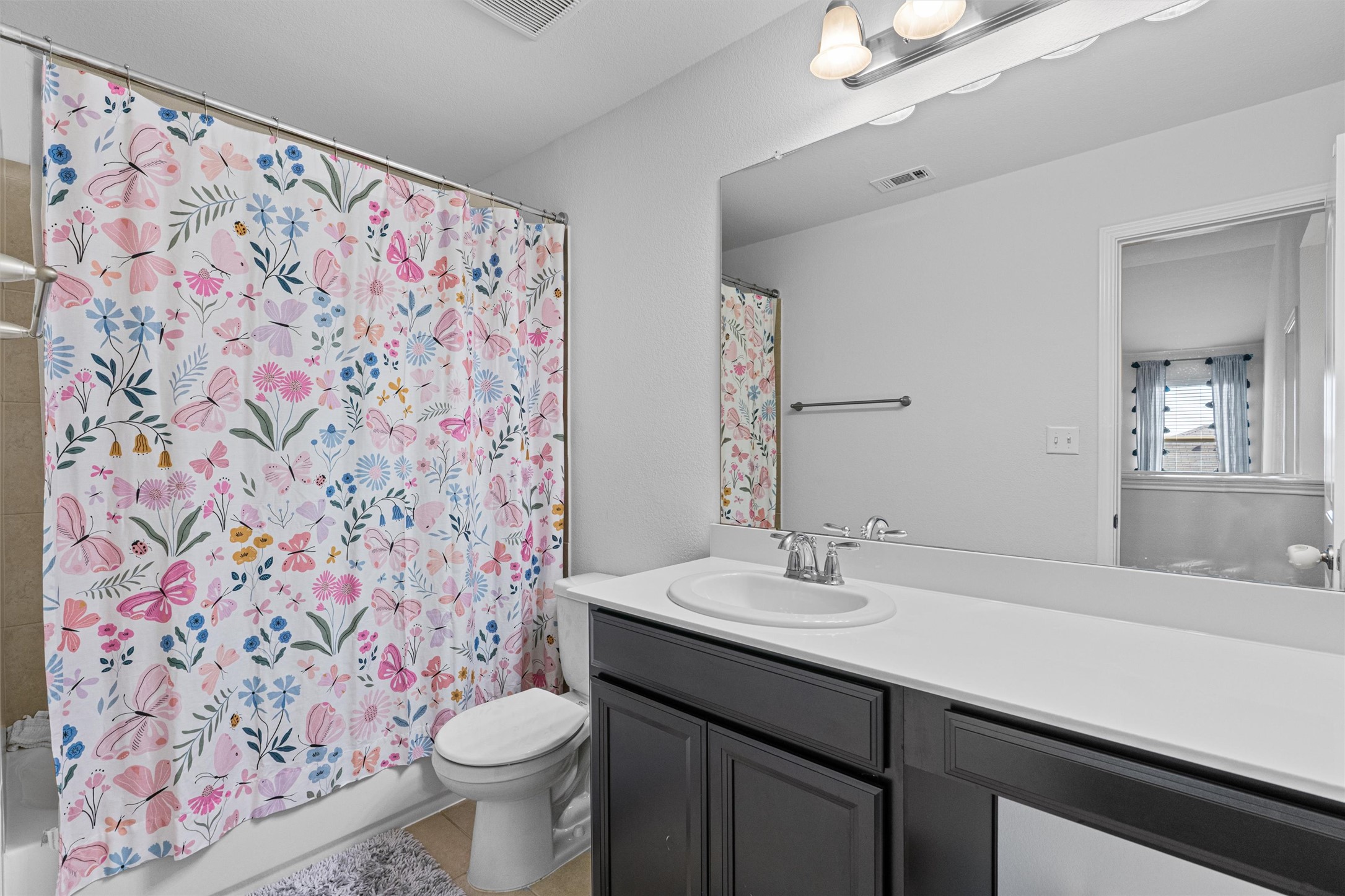 137 Red Sun Drive Kyle, TX 78640 - Photo 29 of 38 a bathroom with a sink and a mirror