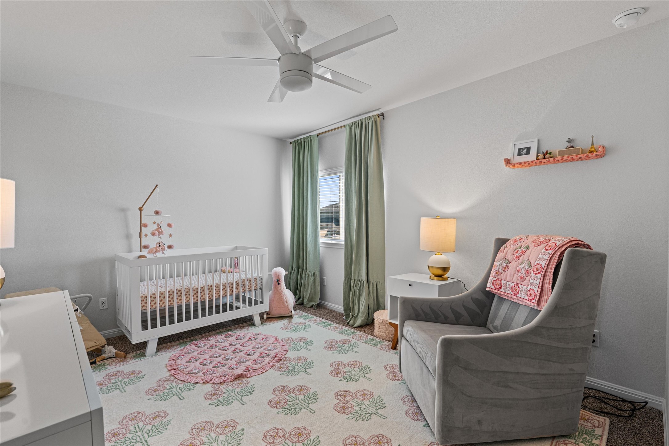 137 Red Sun Drive Kyle, TX 78640 - Photo 30 of 38 a bedroom with furniture and a window