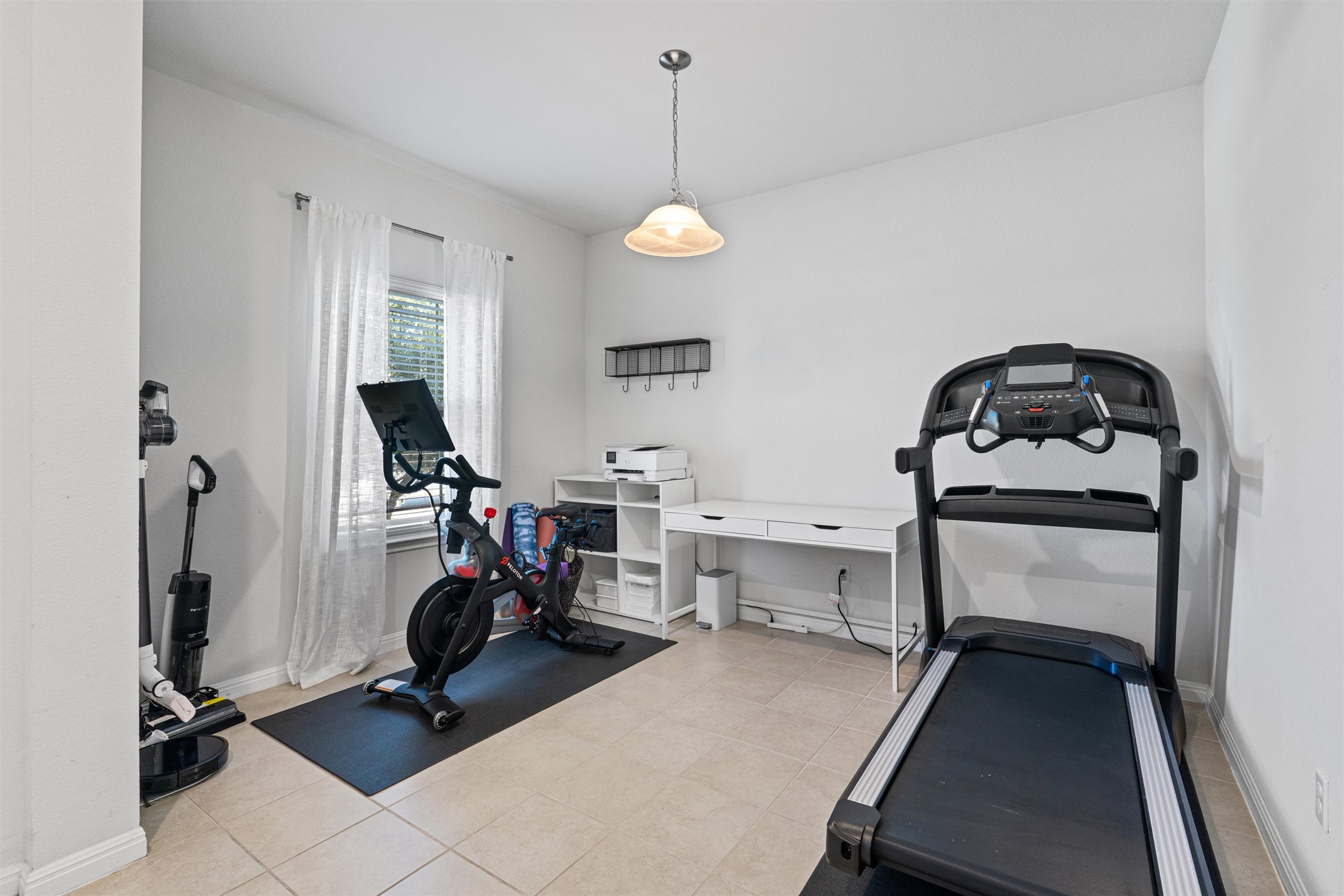 137 Red Sun Drive Kyle, TX 78640 - Photo 3 of 38 a view of a room with gym equipment