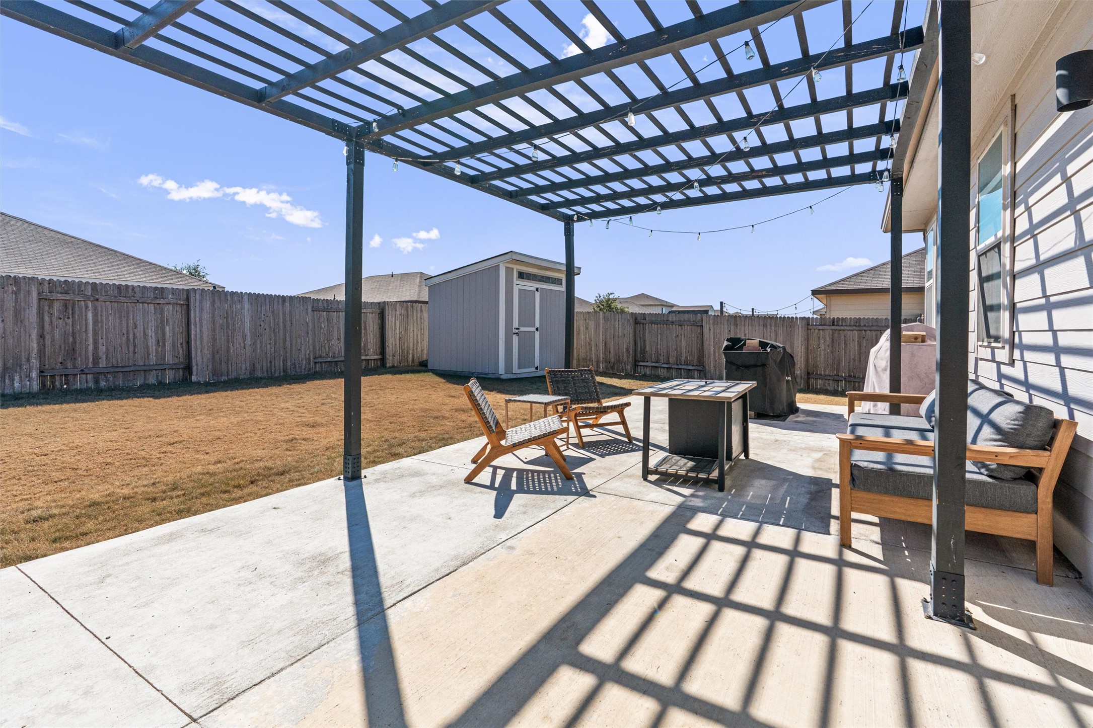 137 Red Sun Drive Kyle, TX 78640 - Photo 32 of 38 a view of a swimming pool with a chairs and tables