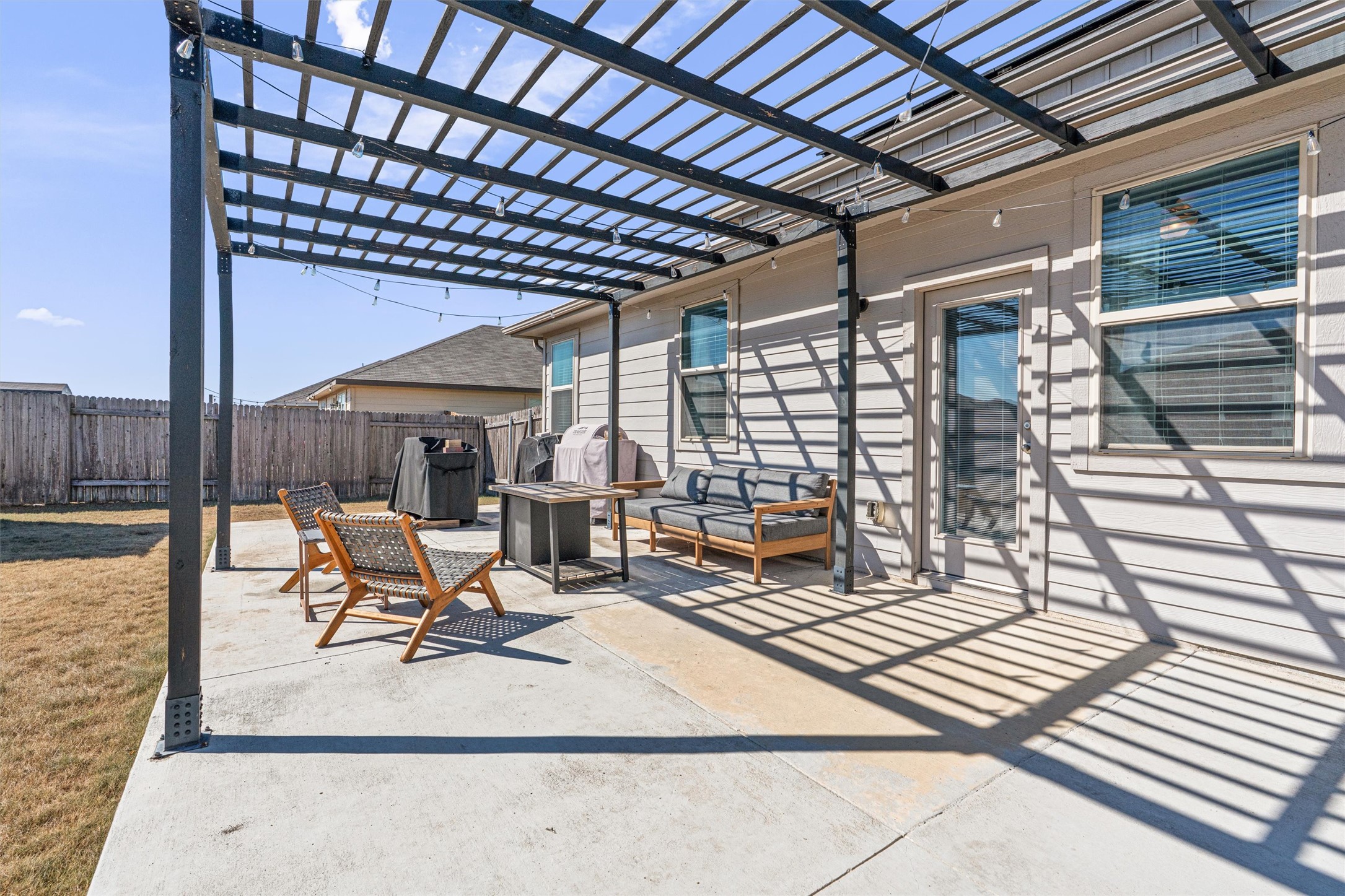 137 Red Sun Drive Kyle, TX 78640 - Photo 33 of 38 a building outdoor space with patio furniture and potted plants