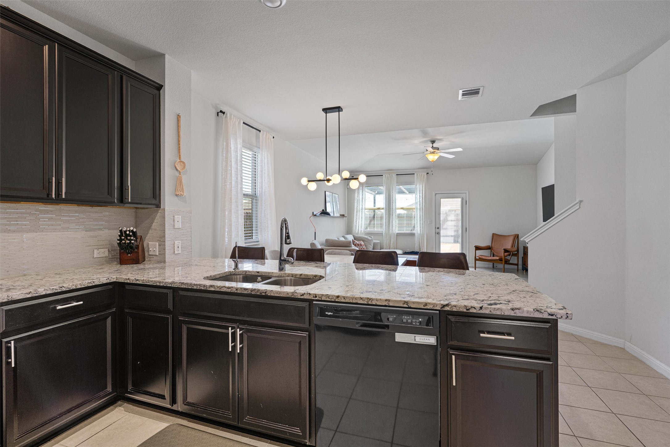 137 Red Sun Drive Kyle, TX 78640 - Photo 5 of 38 a kitchen with a sink and cabinets