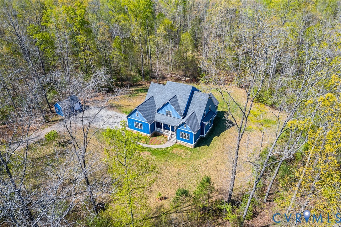 15430 River Road Chesterfield, VA 23838 - Photo 3 of 46 an aerial view of a house with swimming pool and large trees