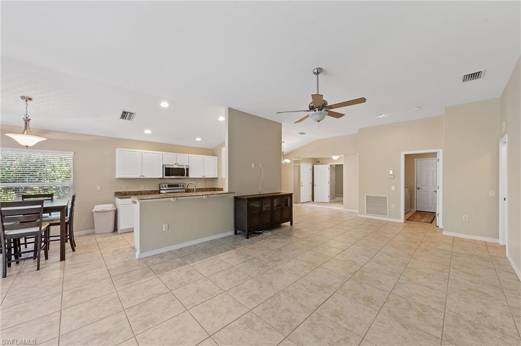 9996 Horse Creek Road Fort Myers, FL 33913 - Photo 15 of 44 a view of kitchen with refrigerator and cabinets