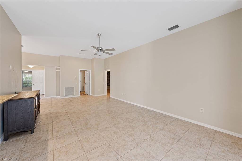 9996 Horse Creek Road Fort Myers, FL 33913 - Photo 16 of 44 an empty room with fireplace and windows