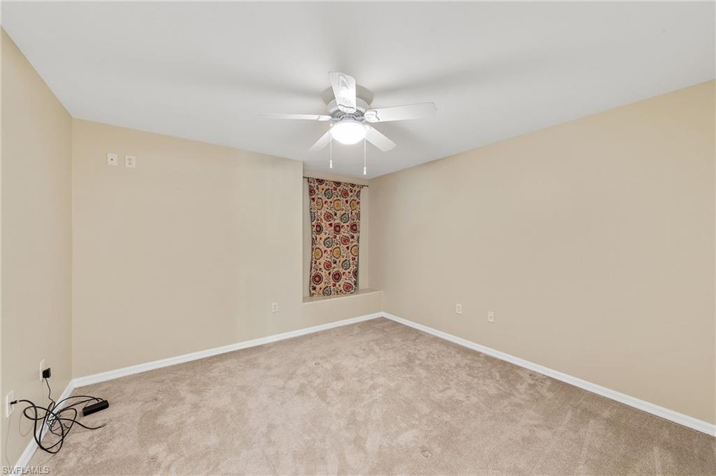 9996 Horse Creek Road Fort Myers, FL 33913 - Photo 23 of 44 an empty room with a window and a ceiling fan
