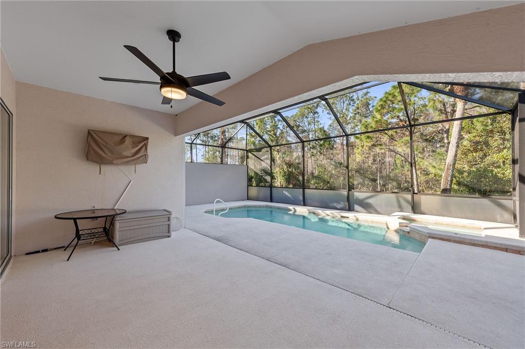 9996 Horse Creek Road Fort Myers, FL 33913 - Photo 32 of 44 a living room with a couch and a floor to ceiling window