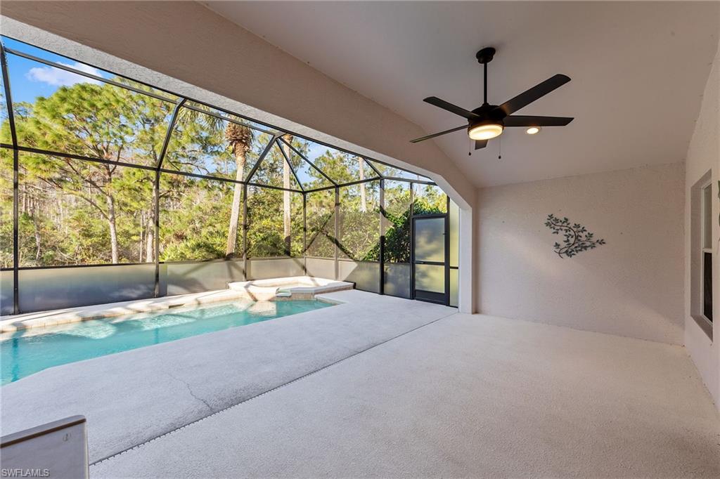 9996 Horse Creek Road Fort Myers, FL 33913 - Photo 33 of 44 a large bedroom with a large bed and a large window