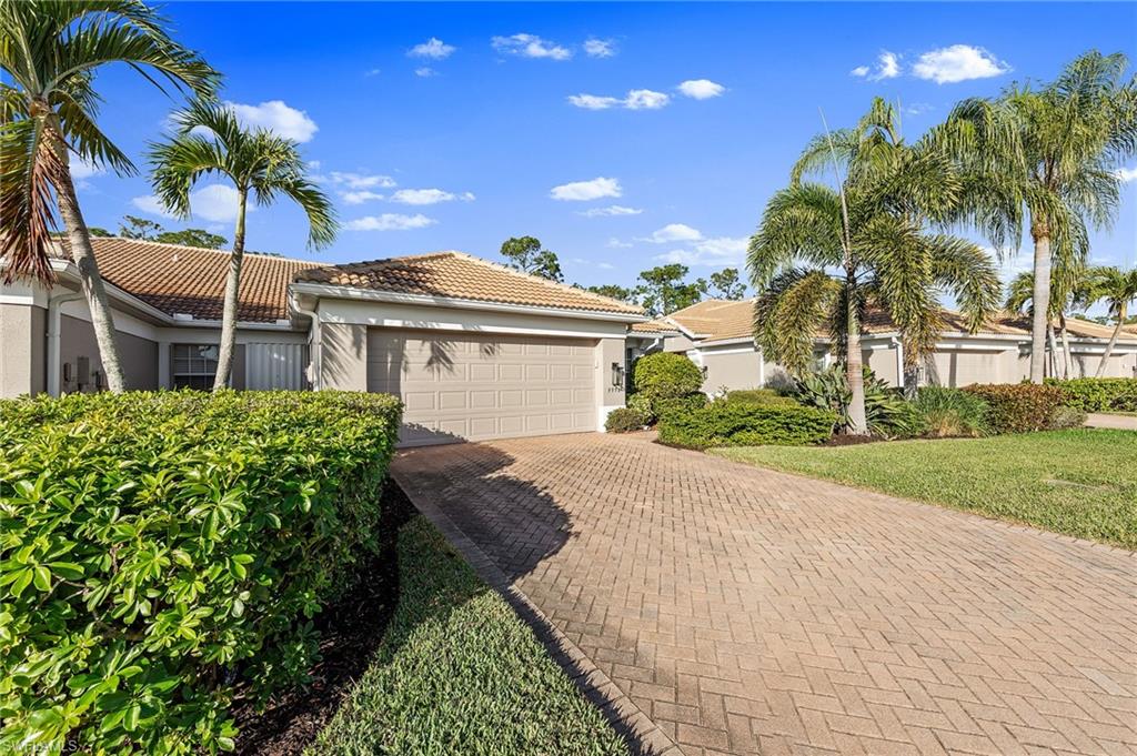 9996 Horse Creek Road Fort Myers, FL 33913 - Photo 5 of 44 a view of a house with a yard and potted plants