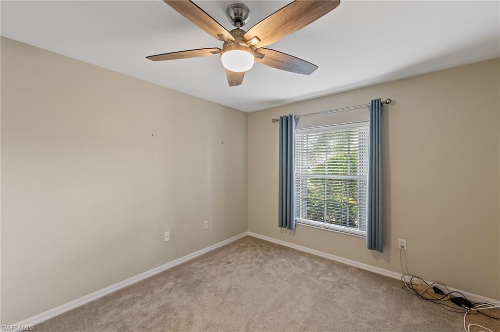 9996 Horse Creek Road Fort Myers, FL 33913 - Photo 10 of 44 an empty room with windows and fan