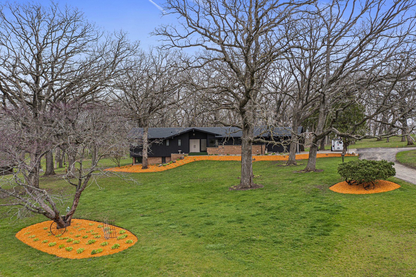 5812 Rotary Road Cherry Valley, IL 61016 - Photo 1 of 28 a backyard of a house with table and chairs