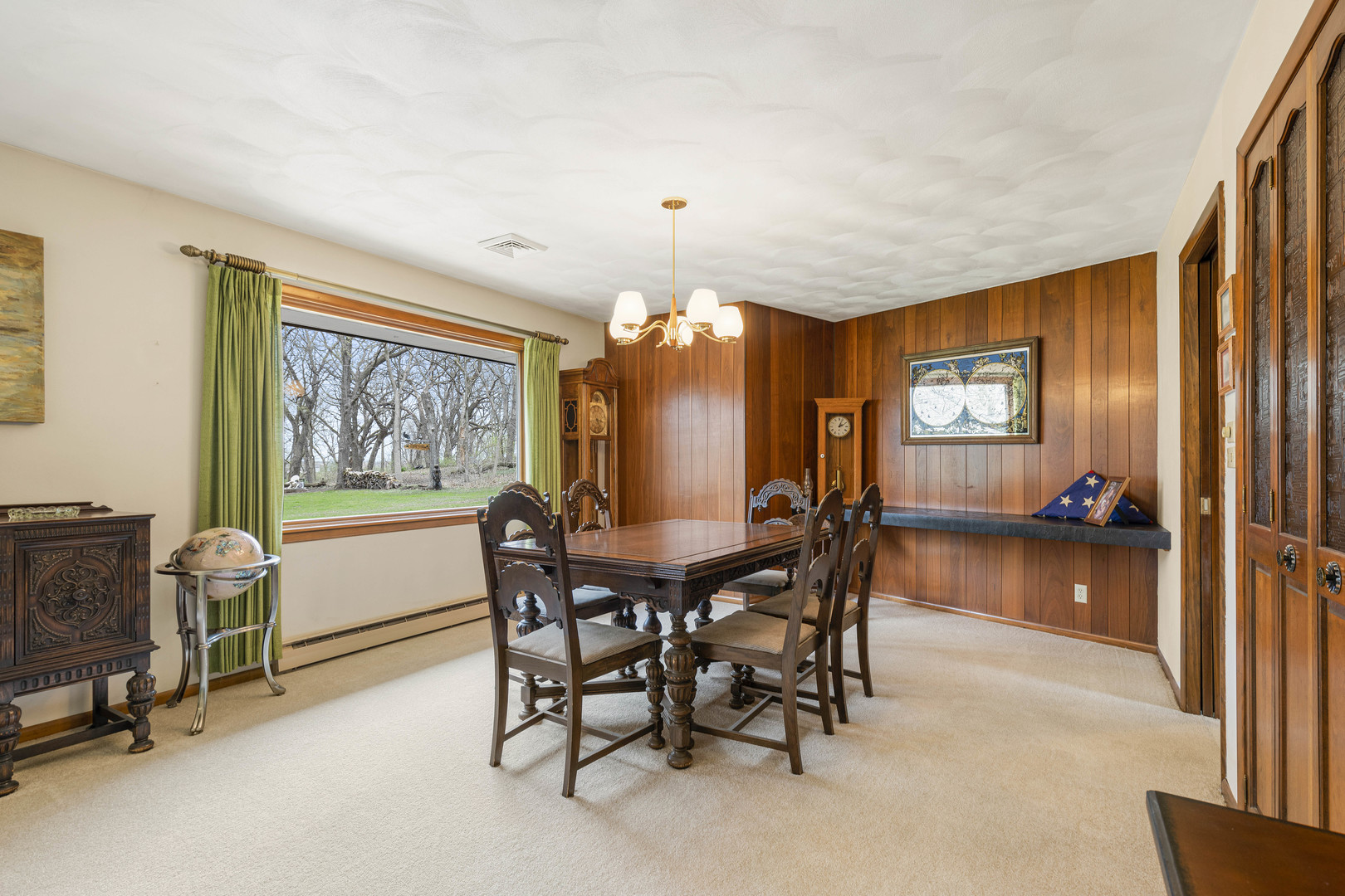 5812 Rotary Road Cherry Valley, IL 61016 - Photo 11 of 28 a view of a dining room with furniture and chandelier