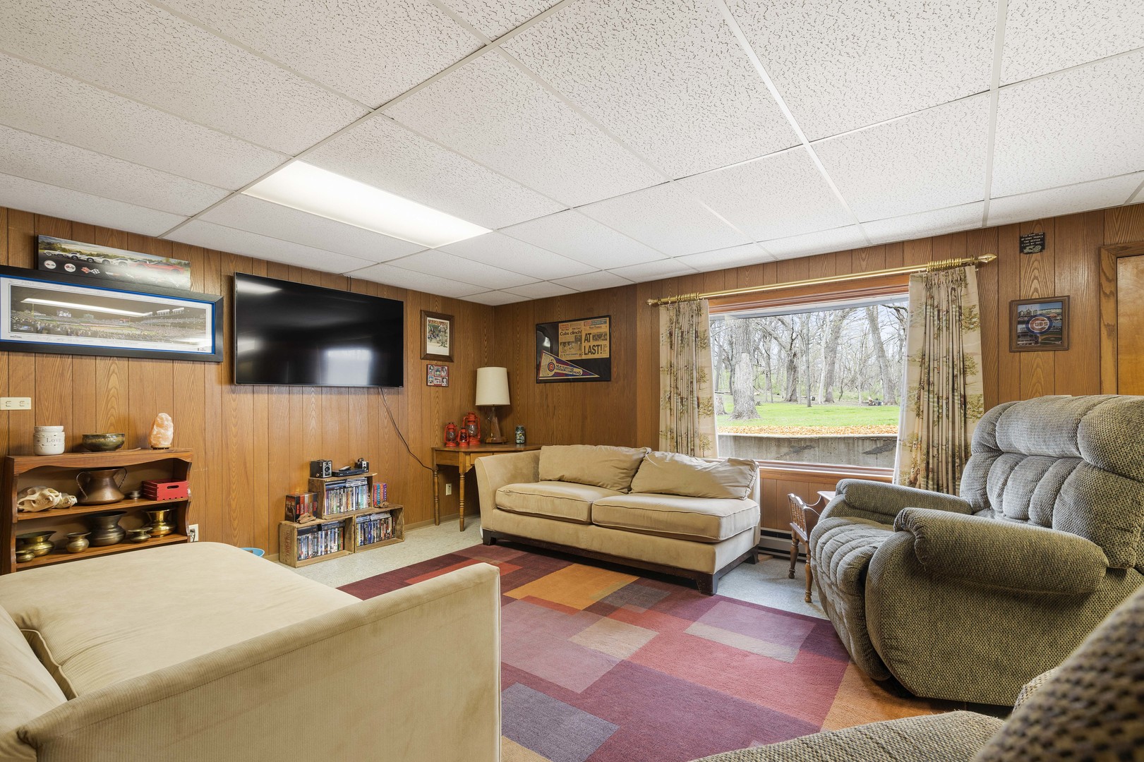 5812 Rotary Road Cherry Valley, IL 61016 - Photo 18 of 28 a living room with furniture and a flat screen tv