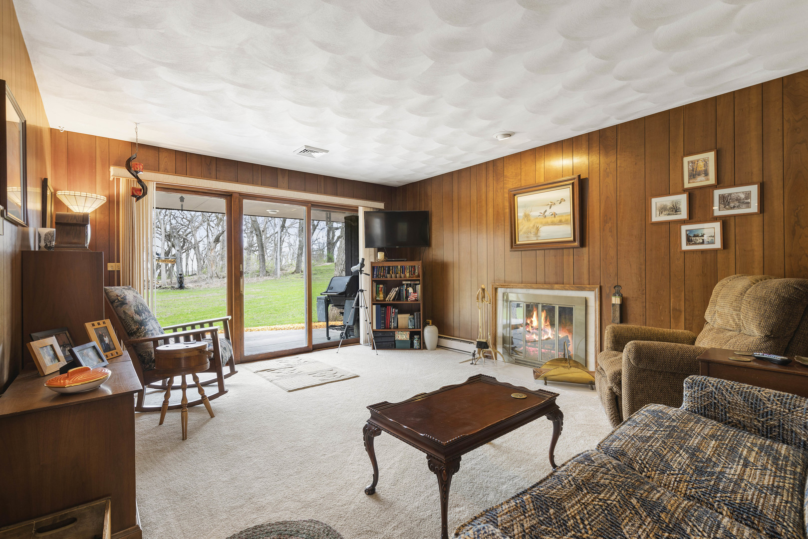 5812 Rotary Road Cherry Valley, IL 61016 - Photo 9 of 28 a living room with furniture and a flat screen tv