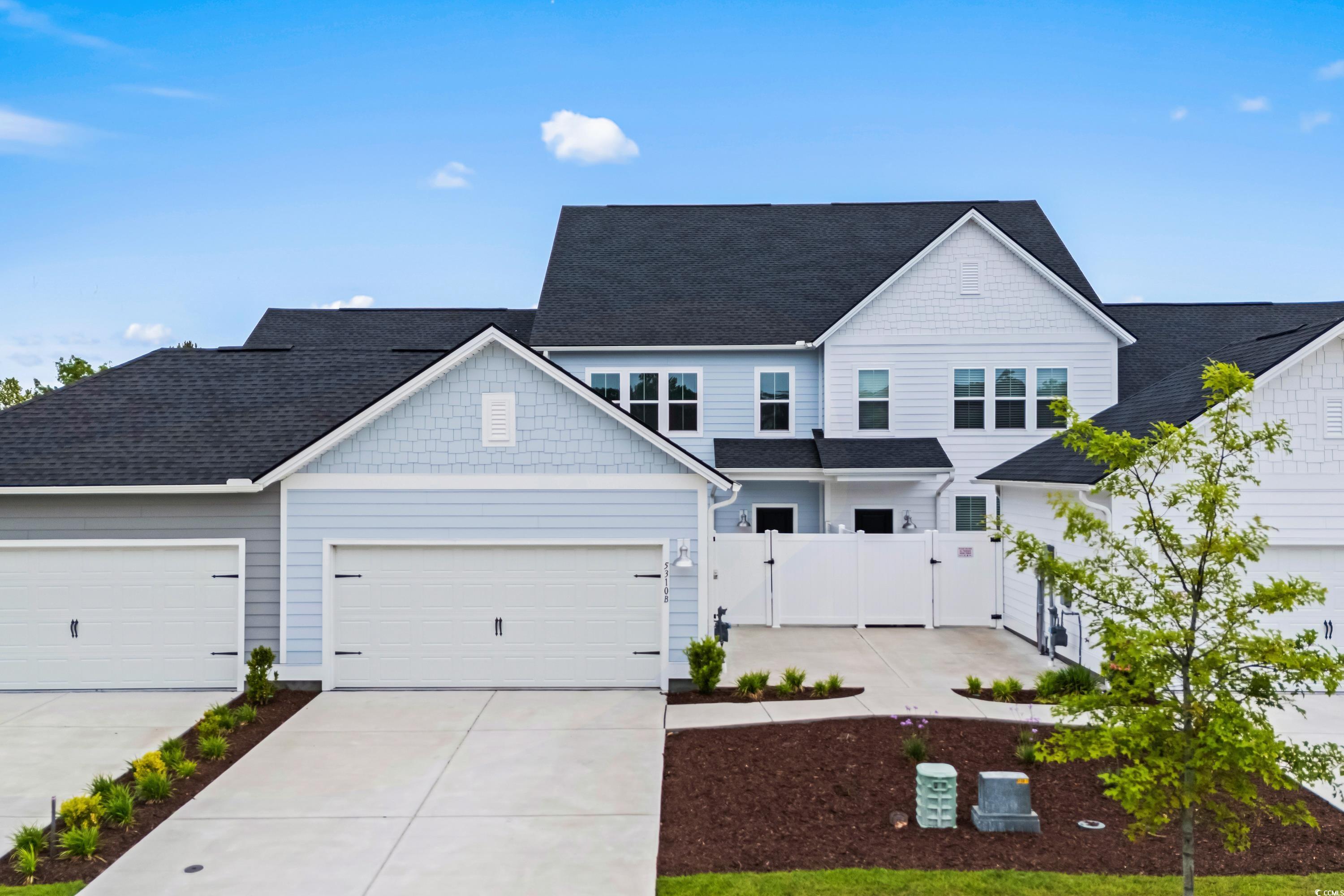 5310 Knobcone Loop, Unit B Myrtle Beach, SC 29577 - Photo 1 of 30 View of front of property featuring a gate, drivew