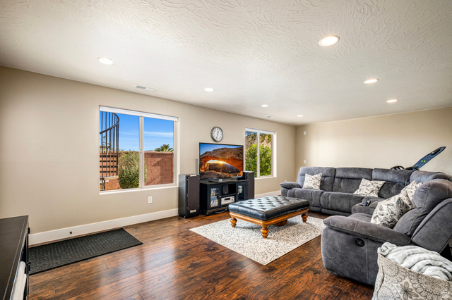 2311 South 1340 West St. George, UT 84770 - Photo 36 of 56 Living area featuring dark wood finished floors, recessed lighting, and a textured ceiling
