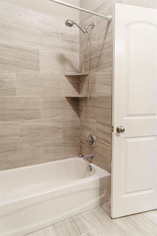2716 Beutel Road Lorena, TX 76655 - Photo 33 of 39 a bathroom with a bathtub and a shower