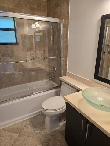 a bathroom with a sink a toilet and a bathtub