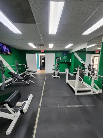a play room with furniture and a flat screen tv
