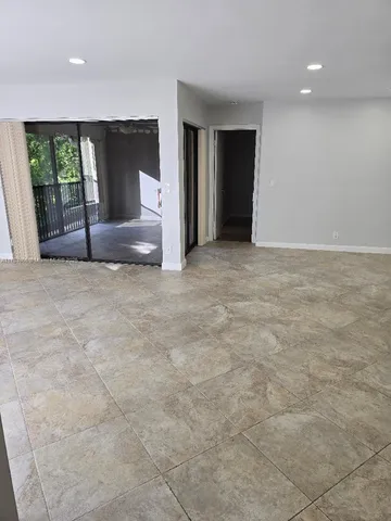 a view of an empty room with a fireplace